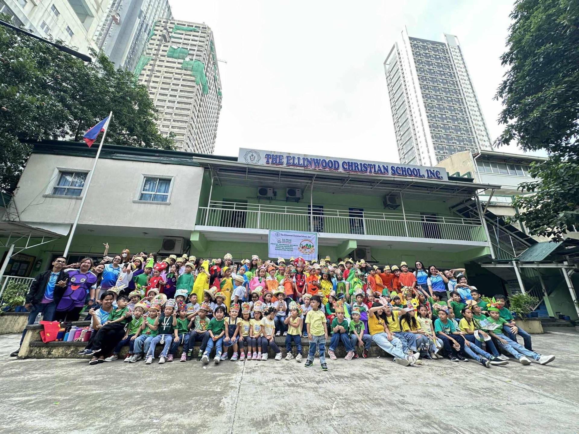 The Ellinwood Christian School students and teachers gathered in front of the campus